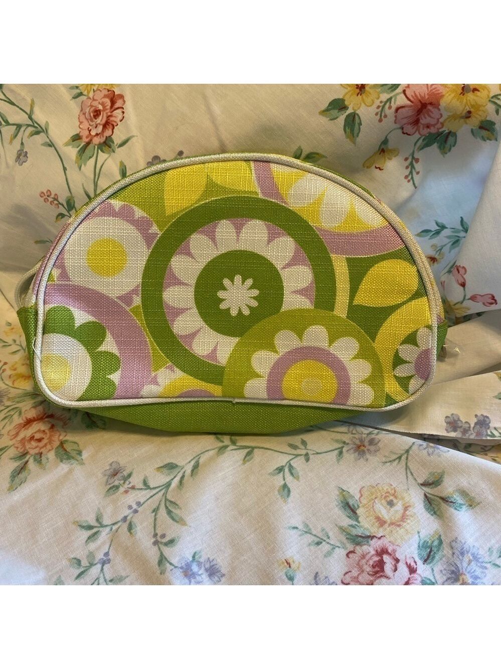 Clinique NWOT cosmetic bag. Green, yellow, purple and white. White inside